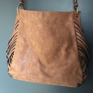Tan faux leather hobo bag.